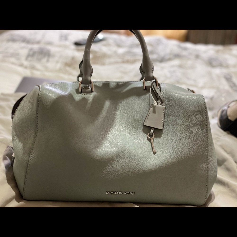 Michael Kors light blue handbag.